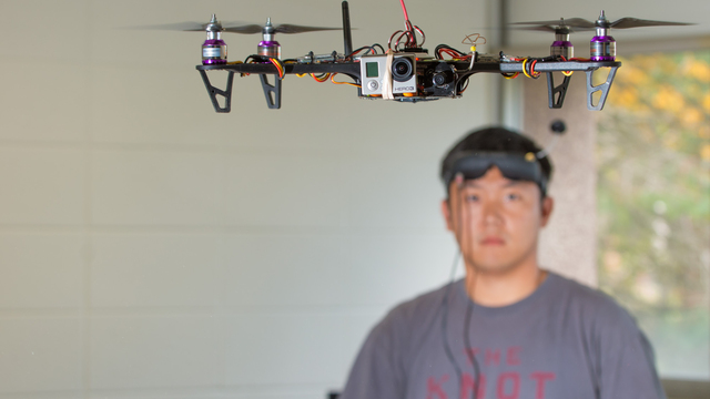 UWEC student working with drone