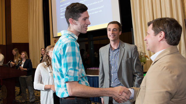 Student shaking hands at networking event