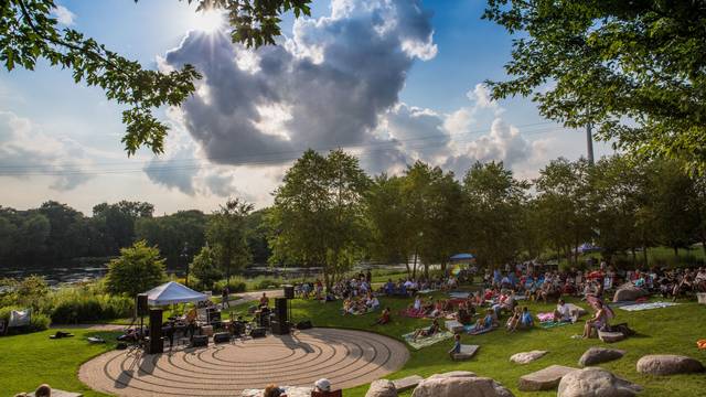Music lovers in Eau Claire enjoying the Sounds Like Summer Concert Series in Phoenix Park.