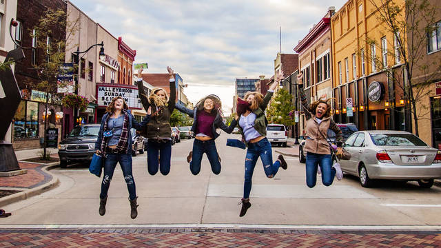 Blugolds jumping in street downtown for UW meets EC