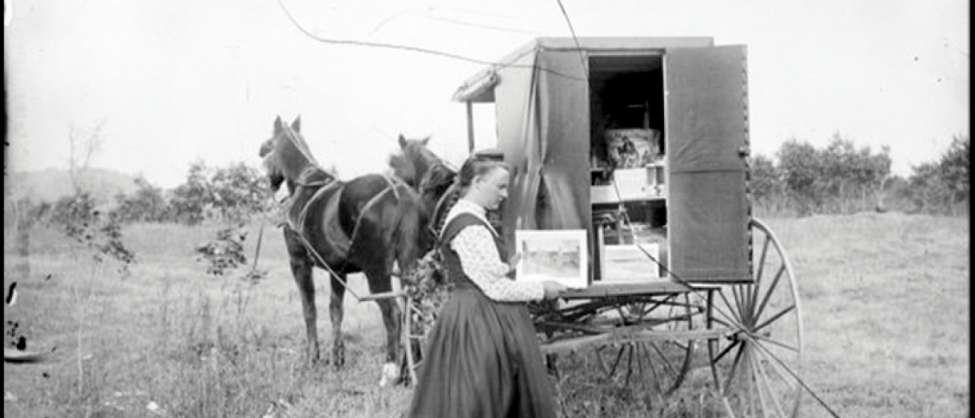 Photo used in "Fauxtography" exhibit, woman by a wagon
