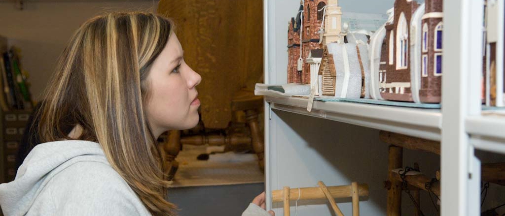 Student studies artifacts at a museum