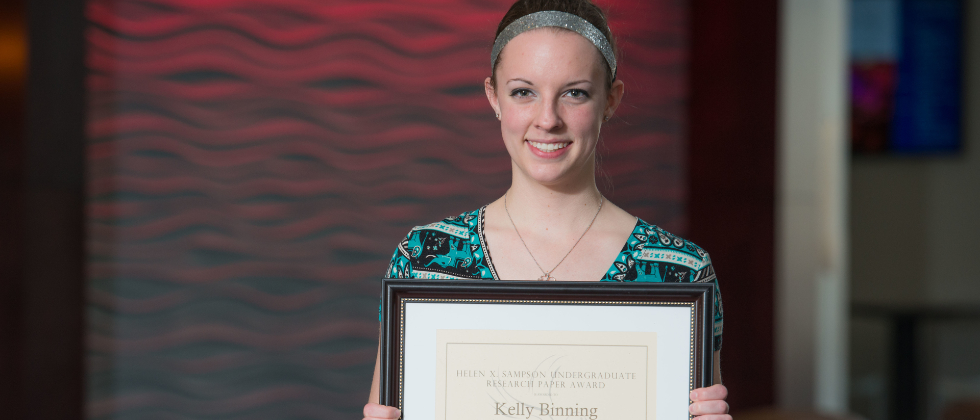 Student Kelly Binning with research award