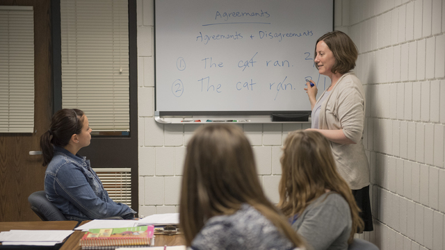 Professor discussing a topic with her class