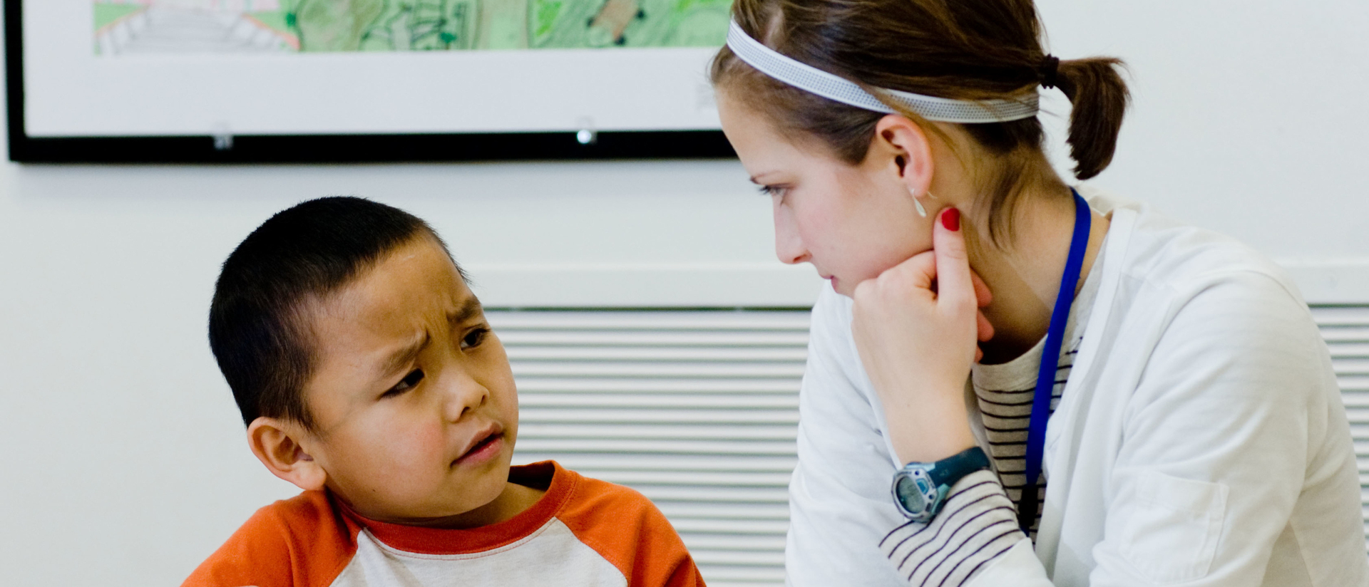 Student working with kid