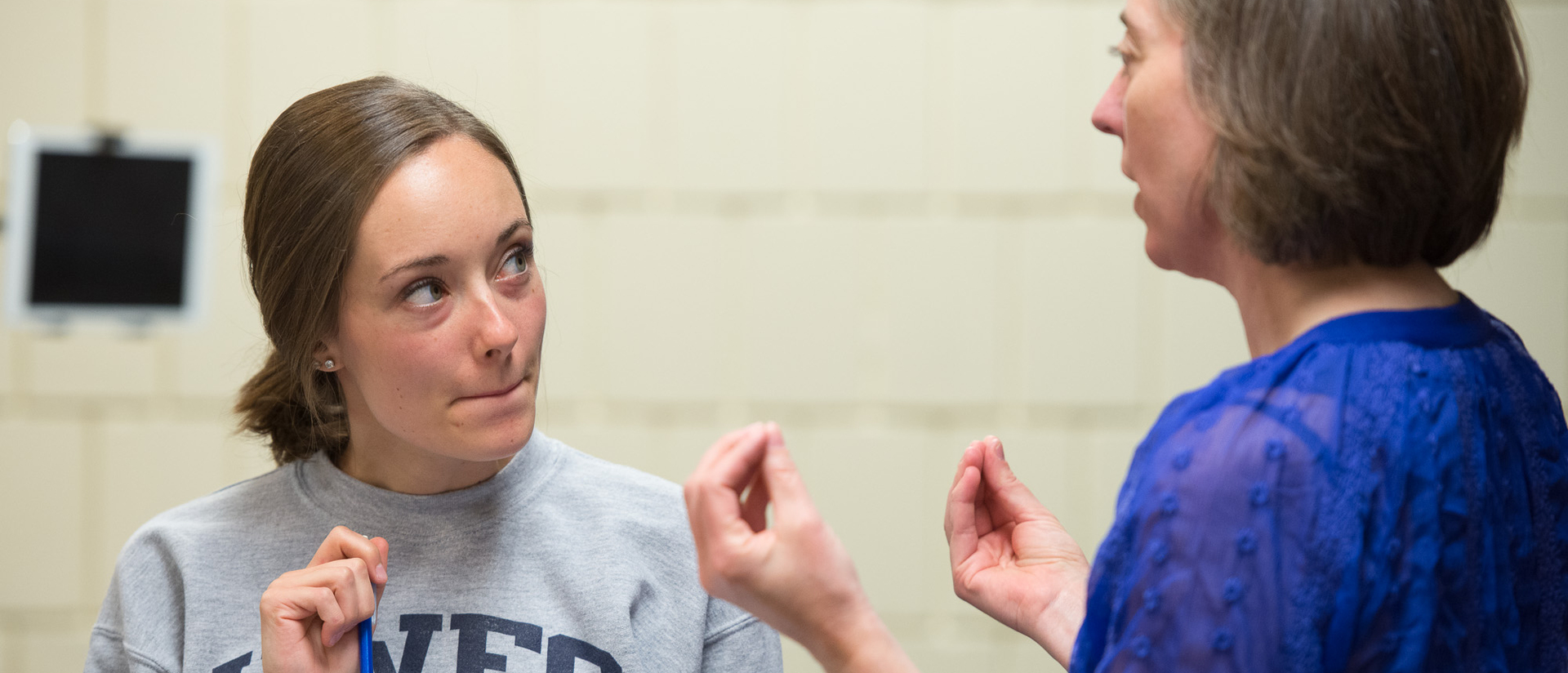 Student and teacher talking