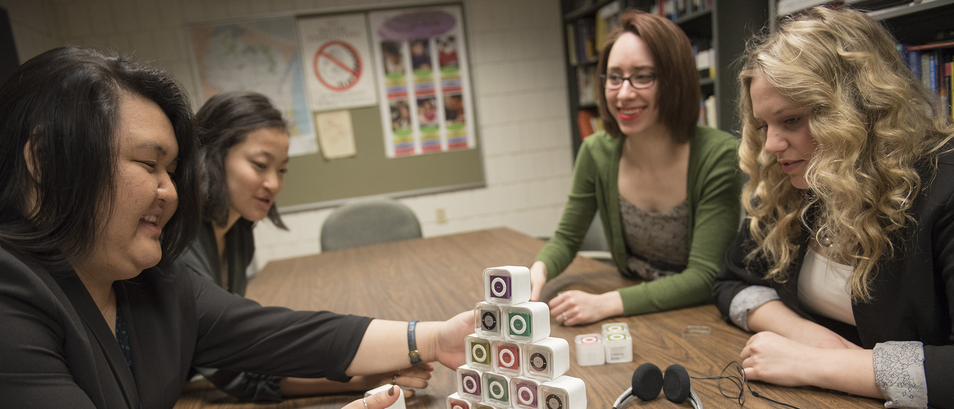 Students building a pyramid of iPods.