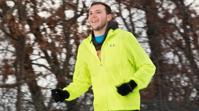 Student running during the winter season.
