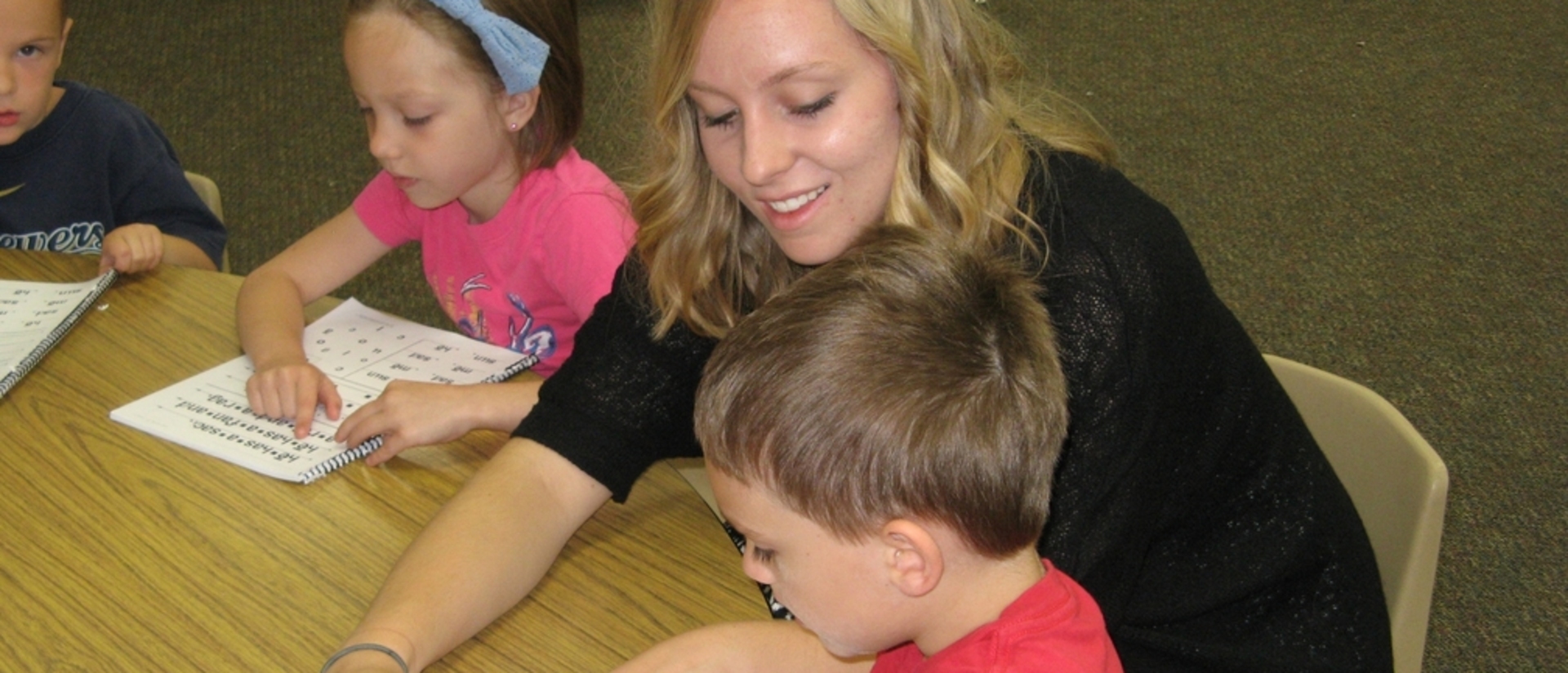 Student working with kids