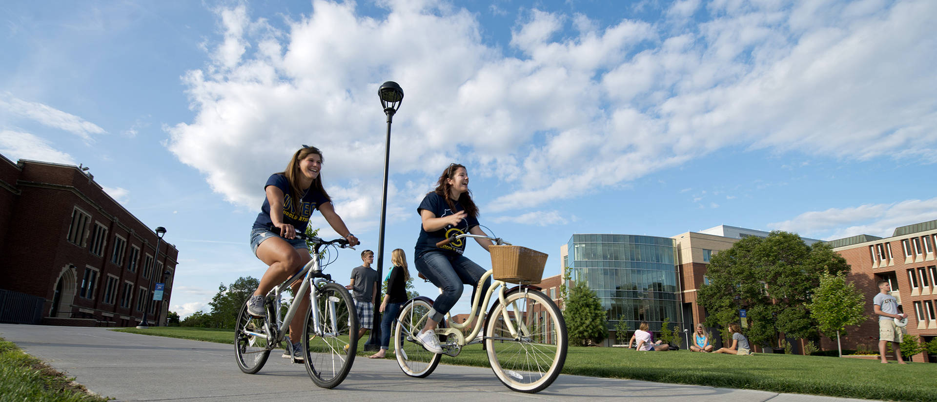 Students riding their bikes on campus.