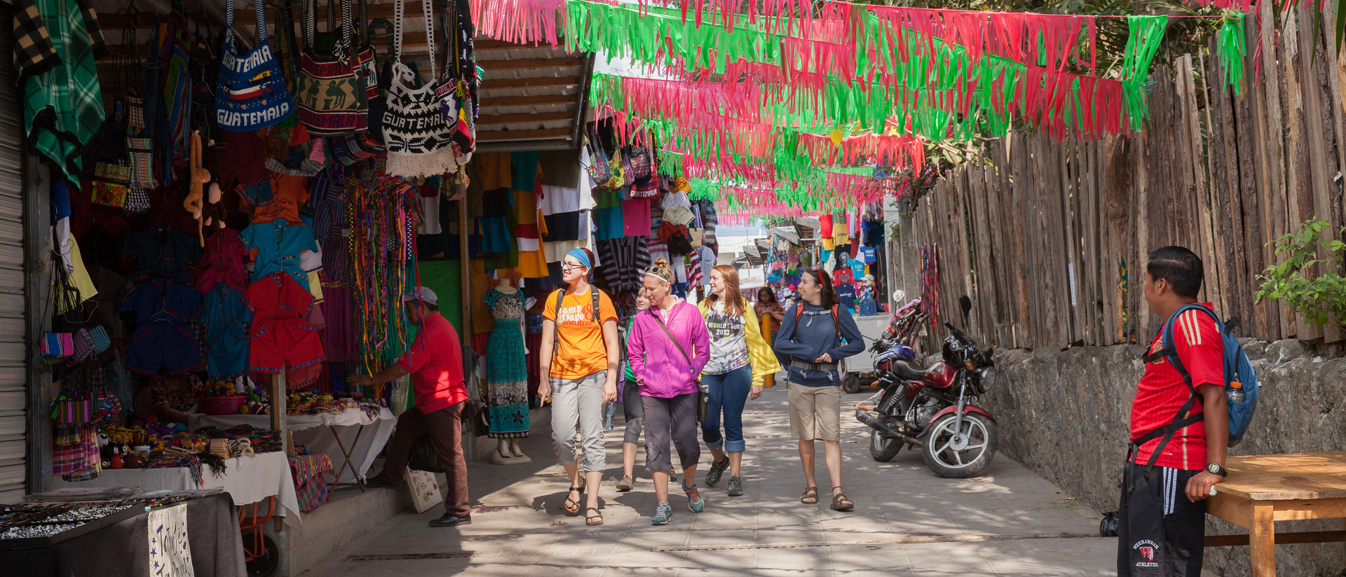 Students walk through street market in Guatemala