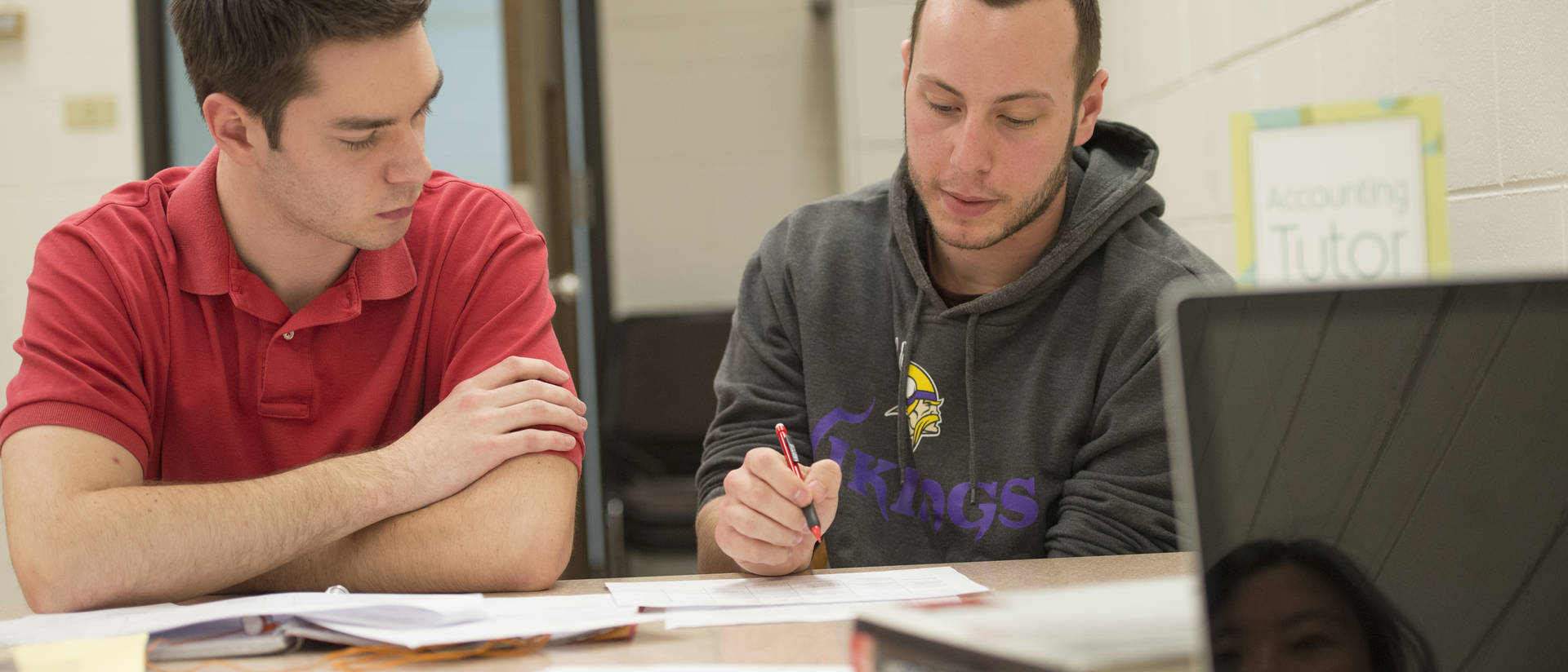 Business students receiving tutoring and academic support.