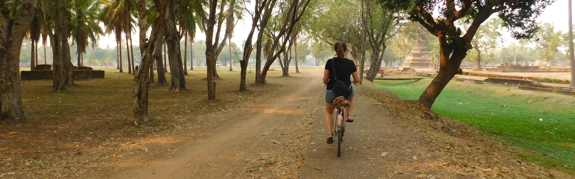 Young woman riding a bike in Chiang Mai, Thailand