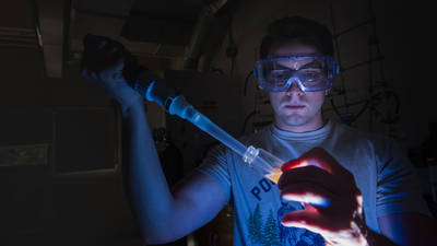 UWEC material science and engineering student working in lab