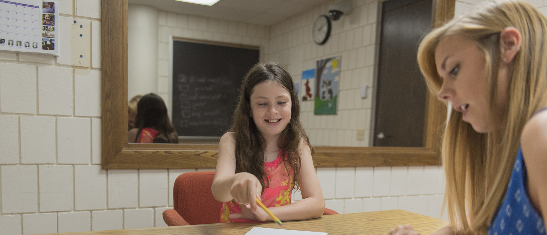 Sophie Topper, 9, is building her math skills and confidence through her work with school psychology graduate student Jill Heitman.