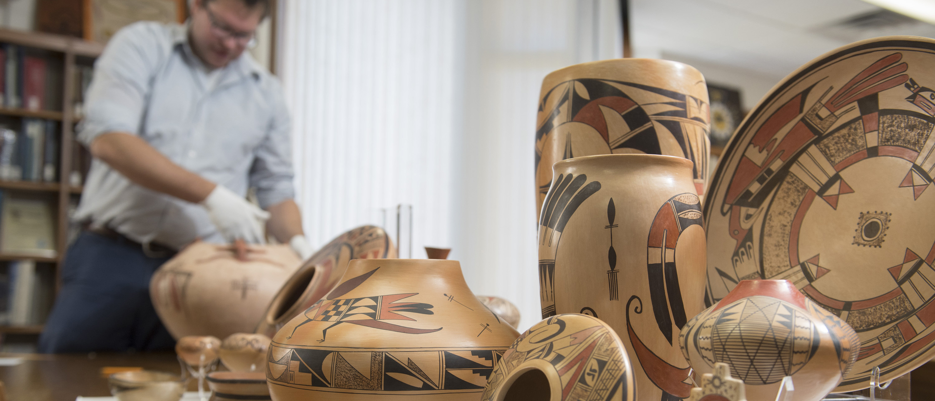 Greg Kocken works with pieces from LaBelle Miller Southwest Pottery Collection 
