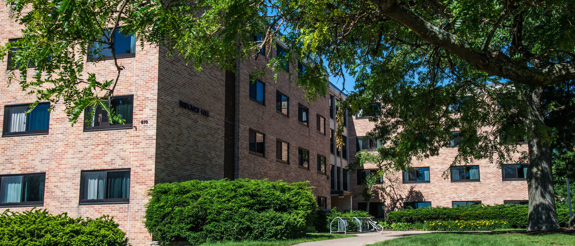 Exterior image of Bridgman Hall including walkway