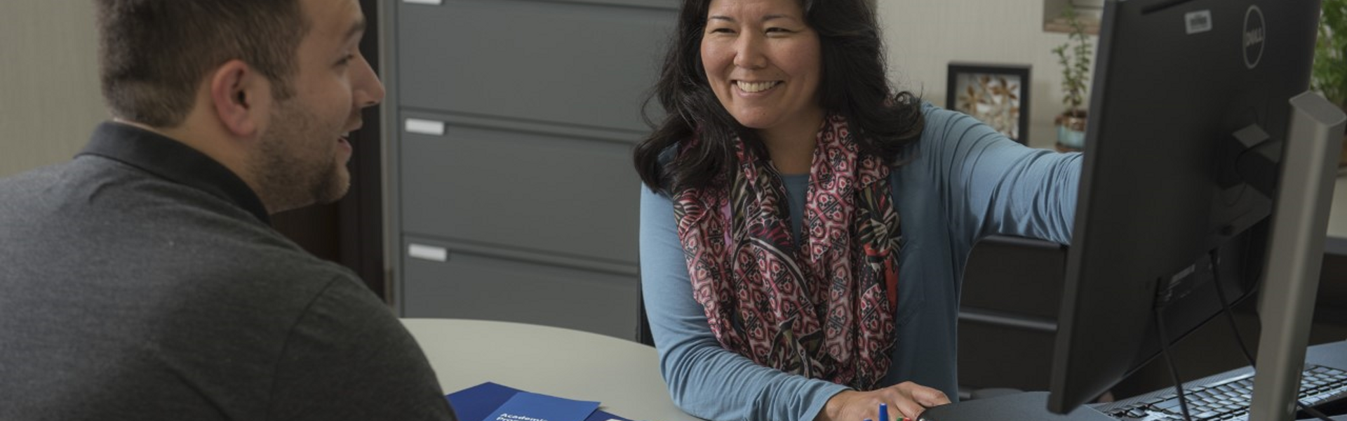 Kim Wellnitz smiles during an advising appointment.