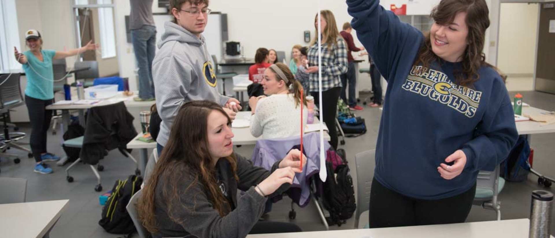 Educations students playing with slime in sensory learning class