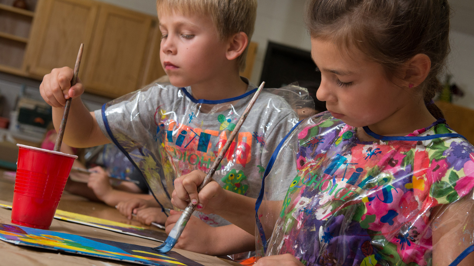 Children painting with watercolors
