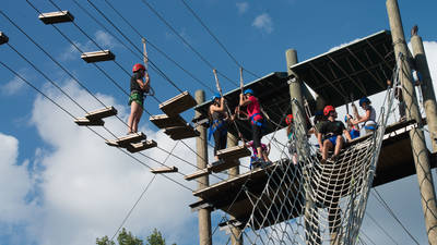 People out on the high ropes course