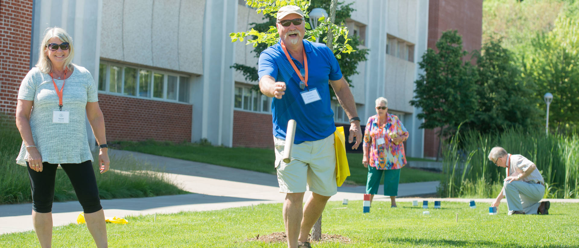 Men and women playing kubb at Senior Americans Day program put on UW-Eau Claire Continuing Education