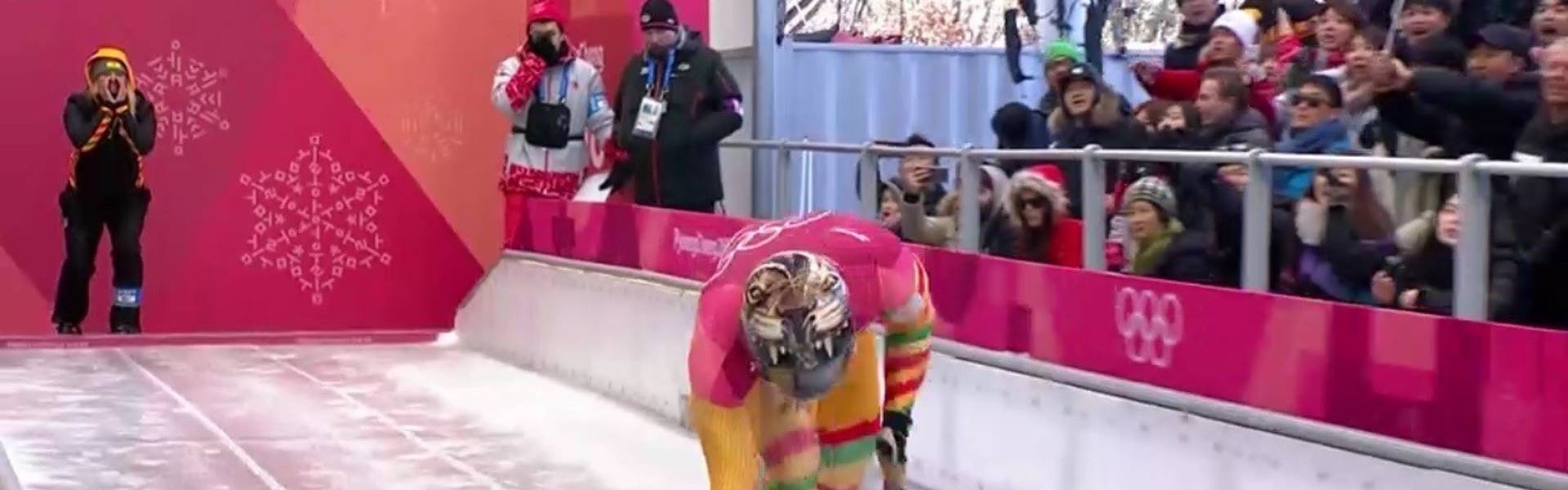 Blugold Lauri Miller Bausch coaches Ghana’s Akwasi Frimpong as he begins a skeleton race during the 2018 Winter Olympics.