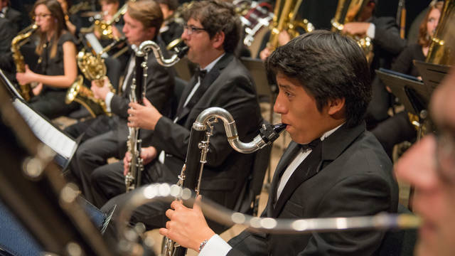 Students on stage performing during Symphony Band rehearsal.