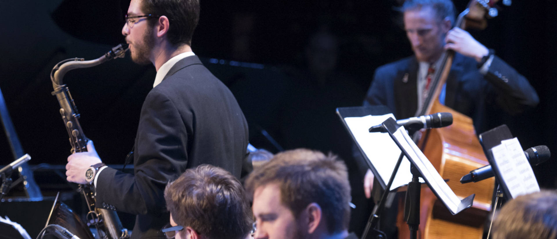 Student saxophonist solos during jazz performance