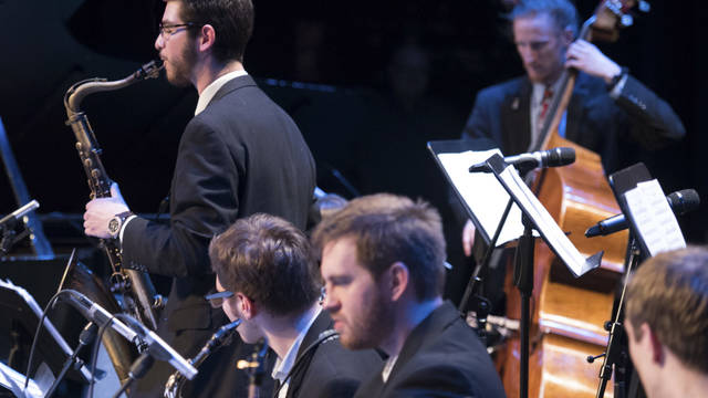Student saxophonist solos during jazz performance