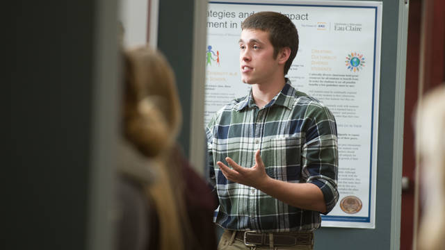 Human diversity student working on a presentation