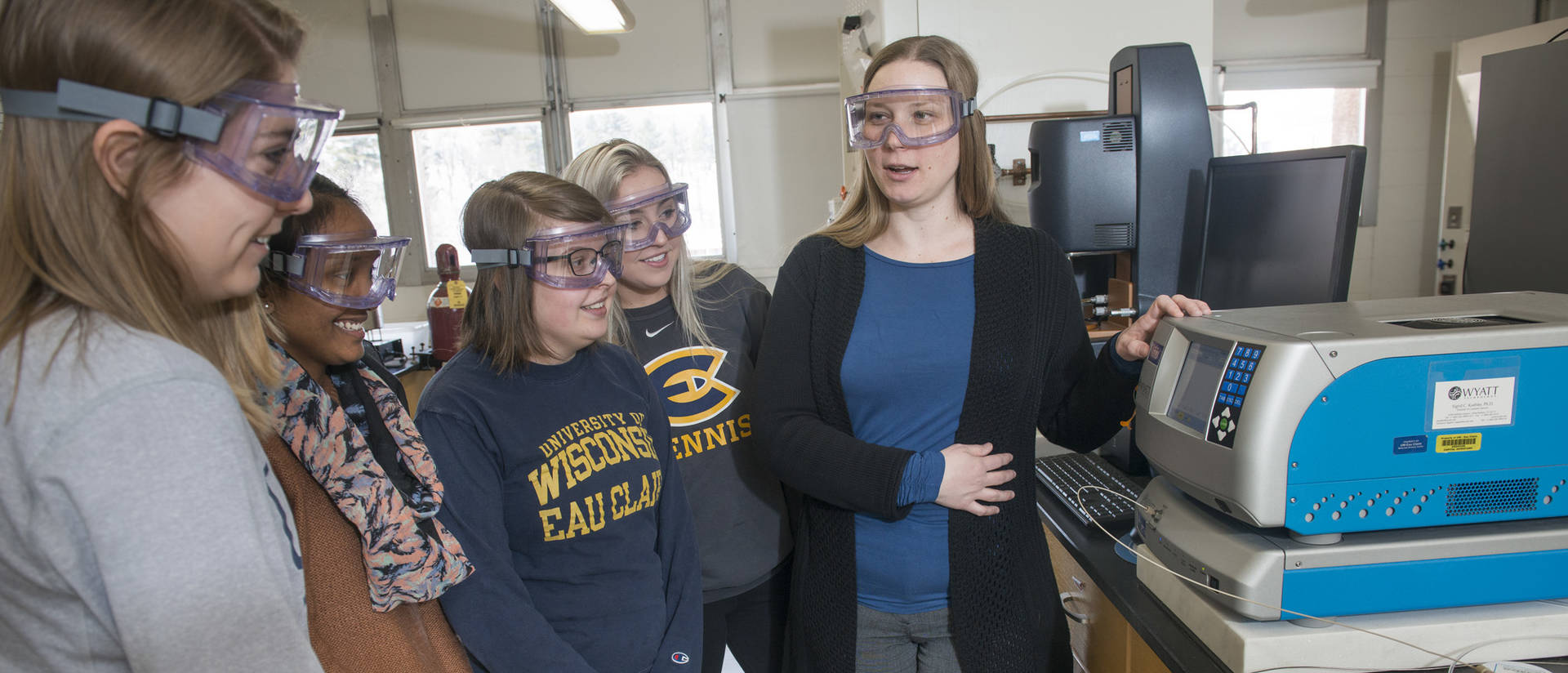 Liz Glogowski and student researchers in materials science lab