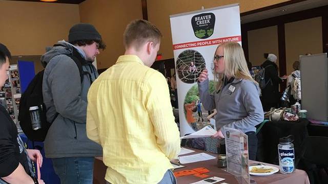 Students talk to organizations about volunteering opportunities at the service-learning and community engagement fair.