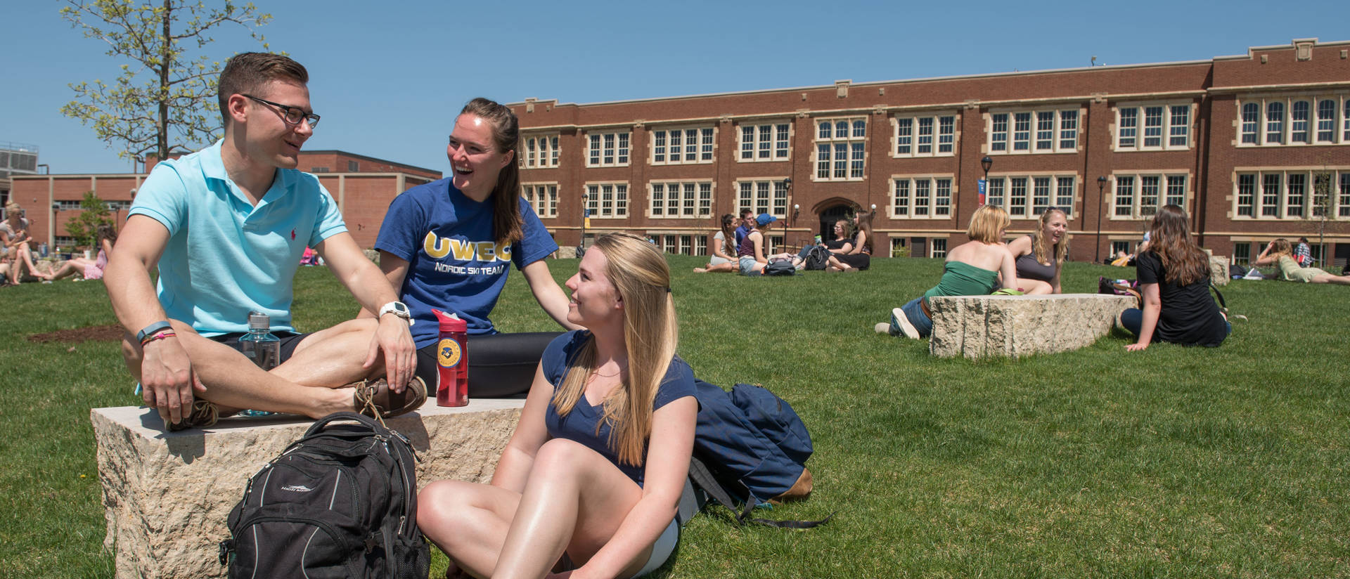 Students enjoy lower campus on a warm spring day.