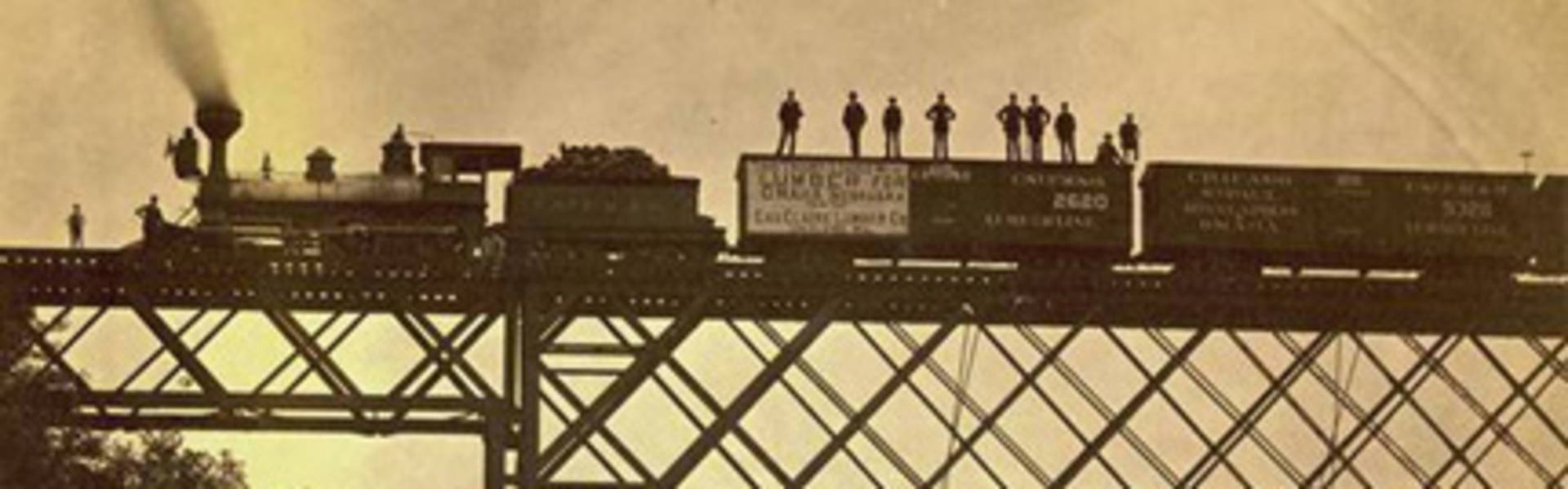 Chippewa Valley Lumber train crossing bridge in 1800s
